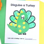 a printout of a turkey decorated to look like a dinosuar