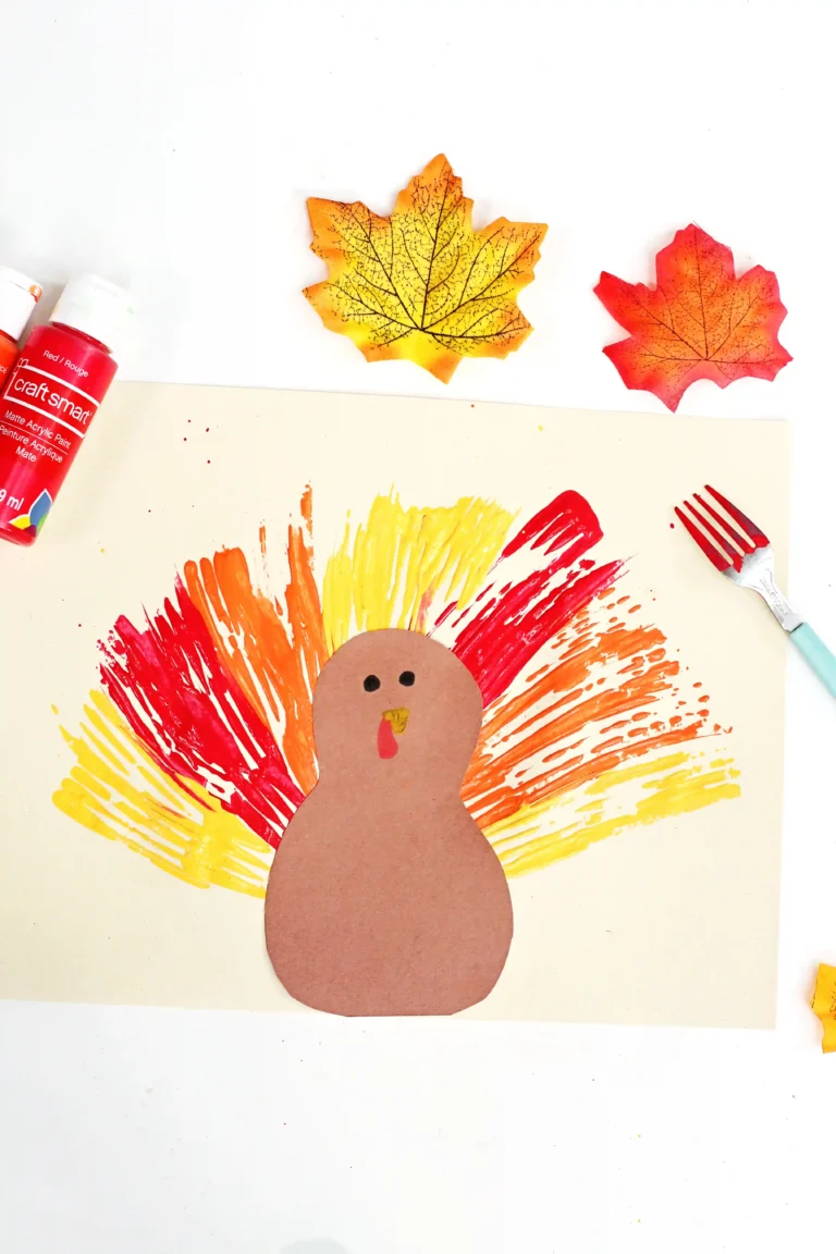 a turkey made out of construction paper with feathers painted on