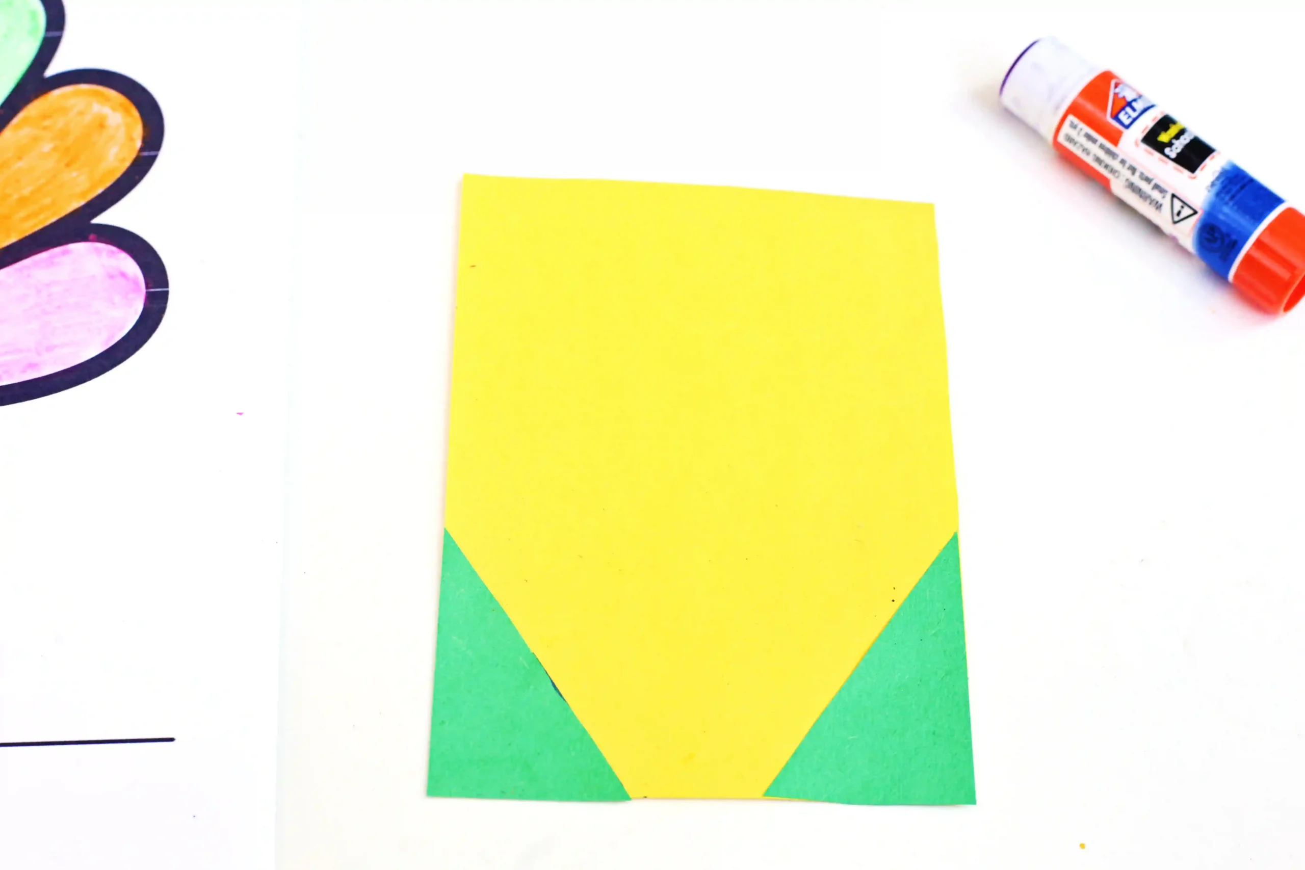 yellow and green construction paper glued together to look like a box of crayons