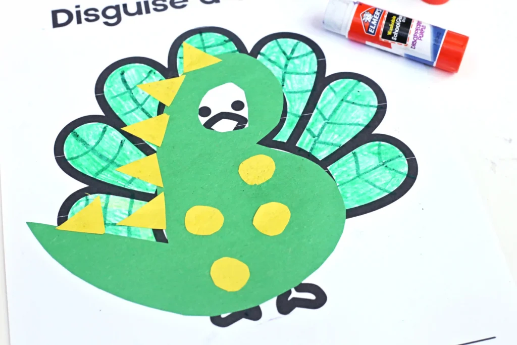 a printout of a turkey decorated to look like a dinosaur