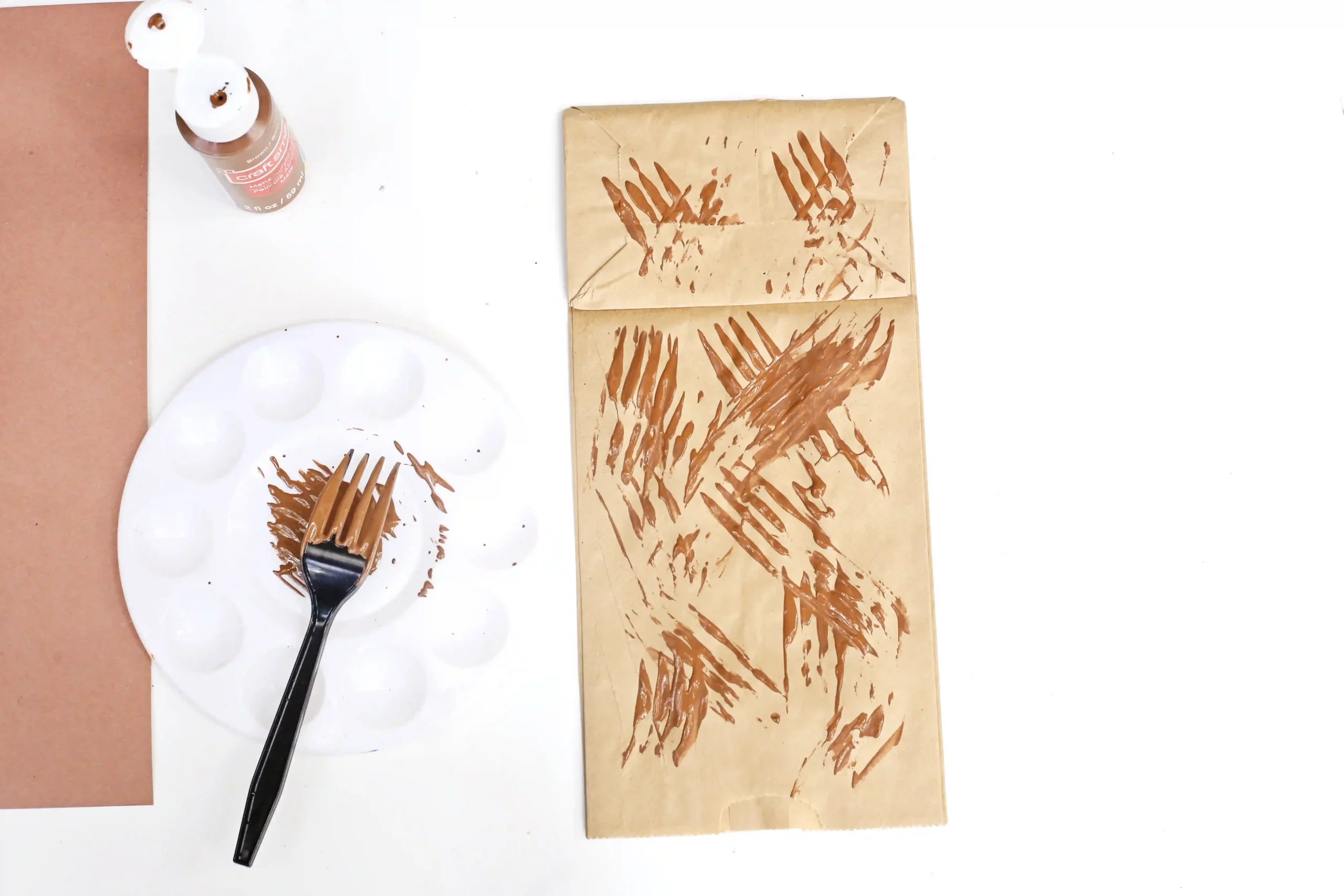 a paper bag with brown paint on it