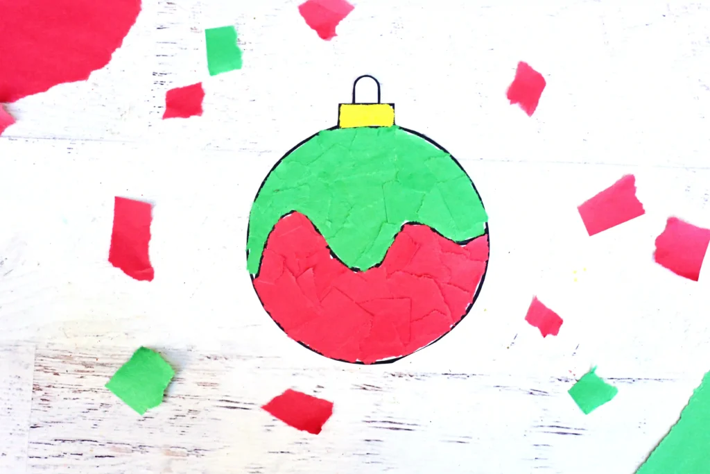 a print out of an ornament with torn construction paper on it